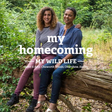 Juliet and Amy sit together on a fallen tree