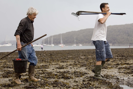 Two happy male volunteers