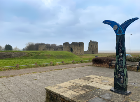 Photo of Flint castle and fish tail sculpture 